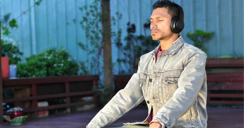 Person listening to audio with headphones